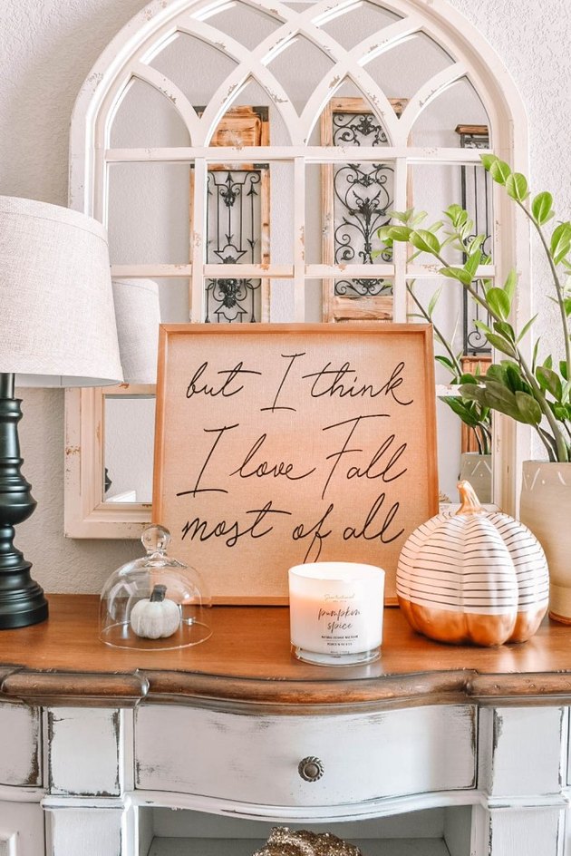 Fall decor idea with sign and white mirror and pumpkins