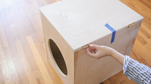 Installing two door hinges on the top and side pieces