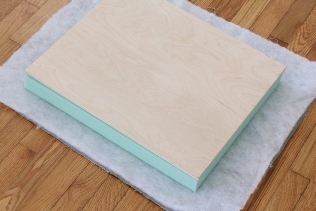 Fabric, batting, foam and plywood layered together