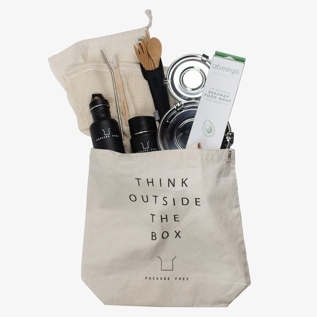 Tote bag with "think outside the box" in text and a variety of eco-friendly items inside
