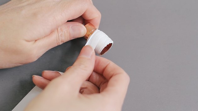 Wrapping plumber's tape around copper coupling
