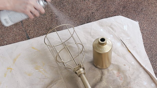 Spraying high heat clear coat on torch and bottle