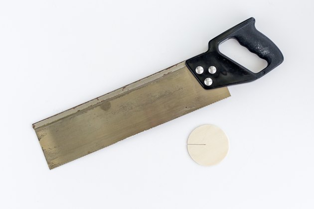 Cut a slit into each disc.