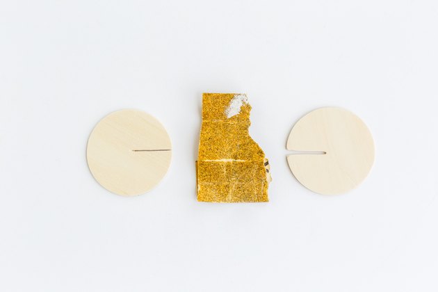Use sandpaper to make the slit bigger.