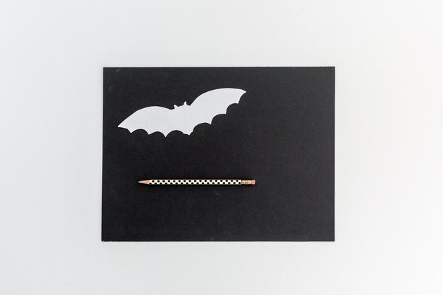Trace the template onto black paper.