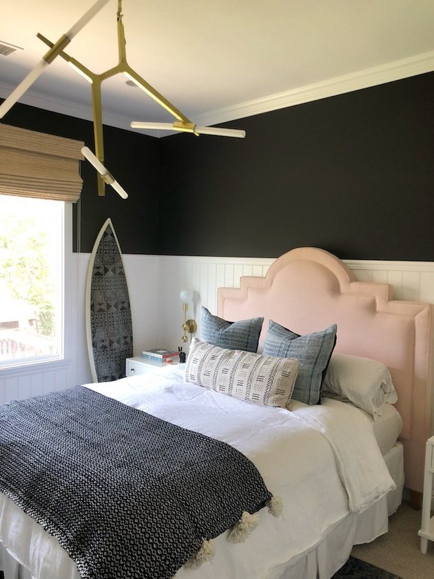 bedroom with white wainscot and black paint above