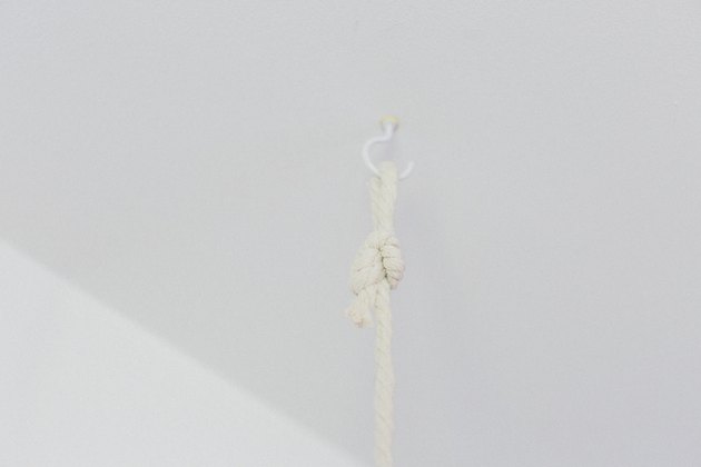 Install two hooks in the ceiling where you plan to hang the garden.