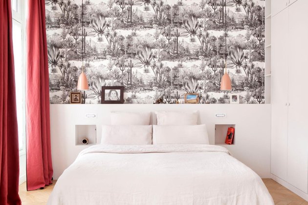 black and white bedroom color idea with wallpaper and red curtains