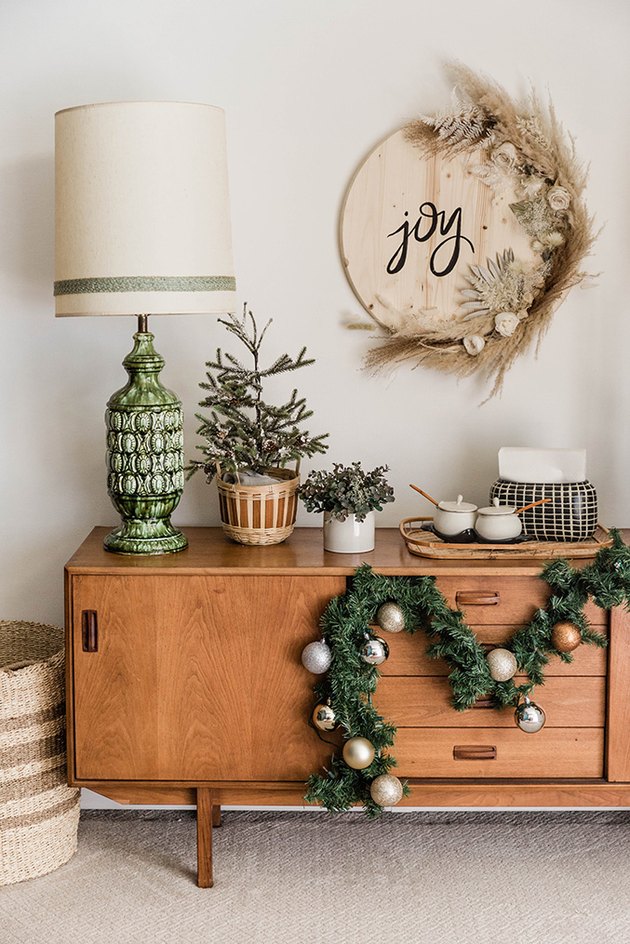 Hang the finished "Joy" sign up on the wall.