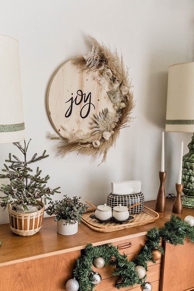 Our DIY dried florals Christmas sign is an earthy way to add festive flair to your holiday décor.