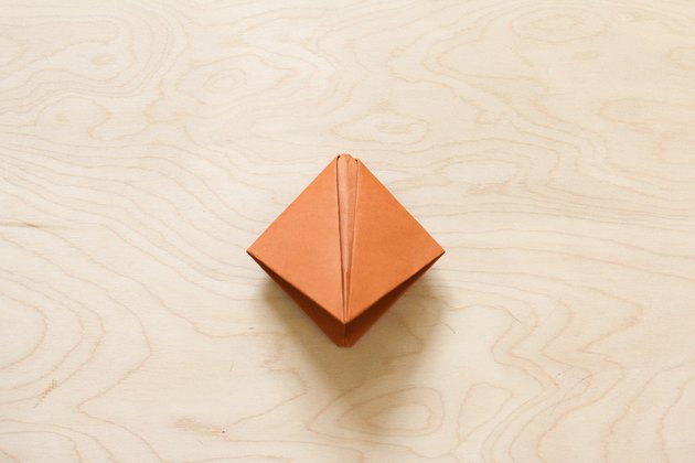 Paper flattened into square shape