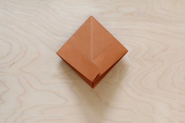 Paper flattened into square shape