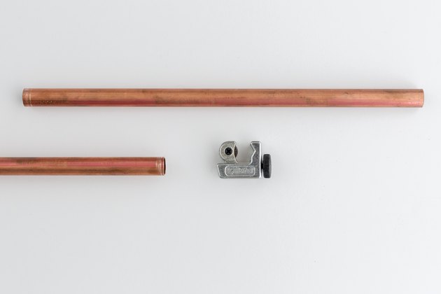 Cut the copper pipe to size.