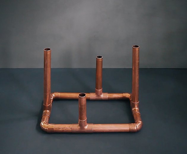 Arms inserted into candelabra base
