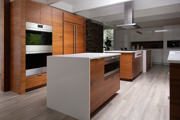 open kitchen with dark wood cabinets and white countertops