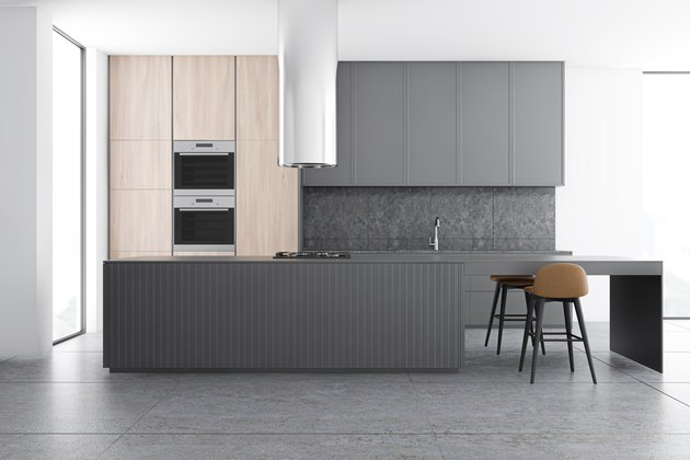 Gray and wooden kitchen interior with bar
