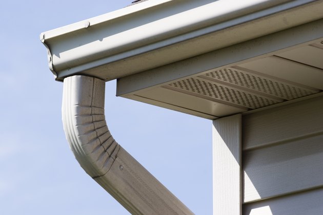 Gutter mounted to fasica board, with ventilated soffit panel.
