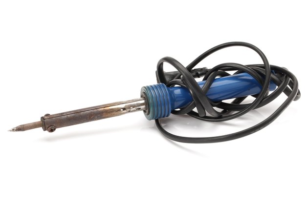 Soldering iron on the white background