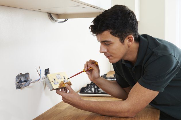 Electrician Installing Socket In New House