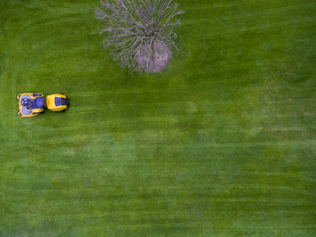 Aerial view of lawn tractor or riding mower. Directly above. Drone view.