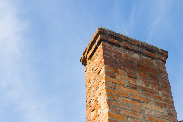 Old chimney and blue clear sky.