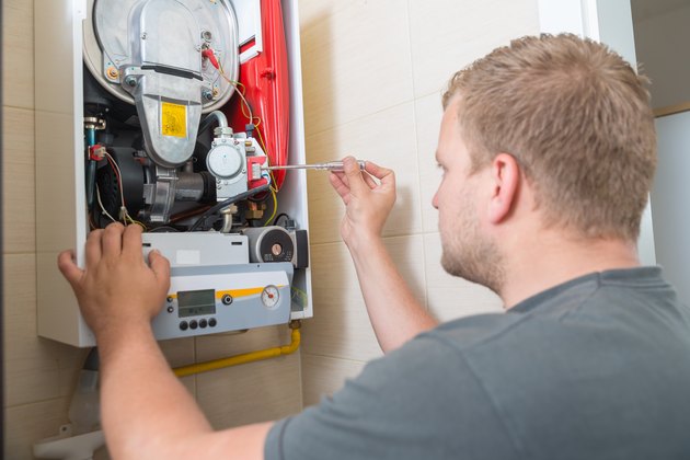 Technician repairing Gas Furnace