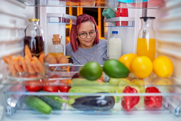 Woman looking in a refrigerator