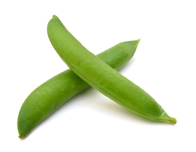 fresh green peas isolated on a white background