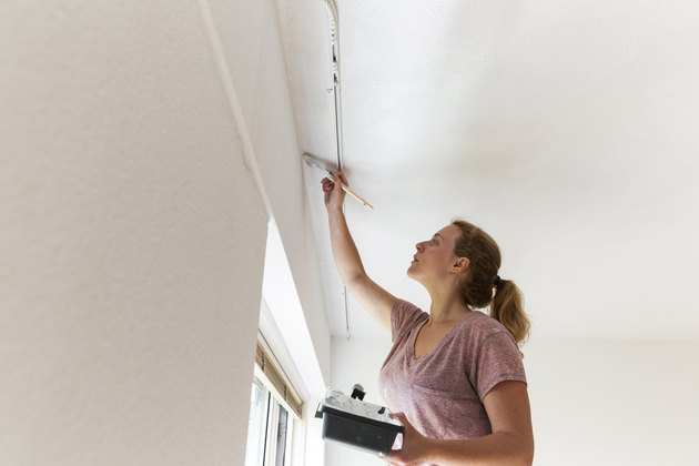 Girl Painting Living Room Ceiling