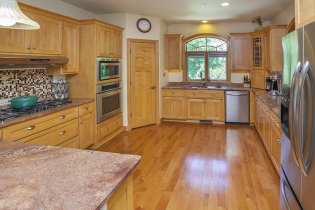 Spacious Custom Kitchen With Hardwood Floor, Cabinets, Marble Counters