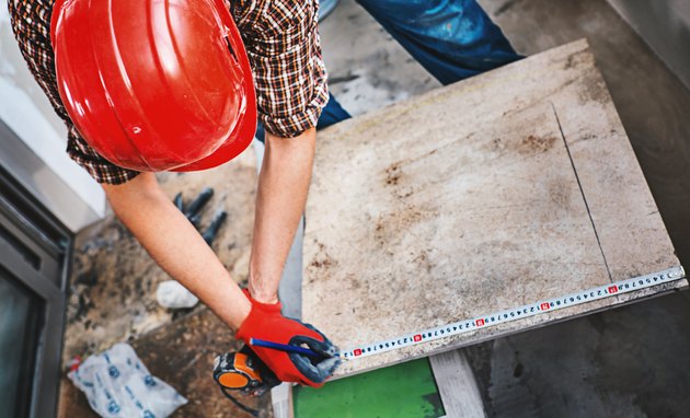 Installing ceramic tiles.