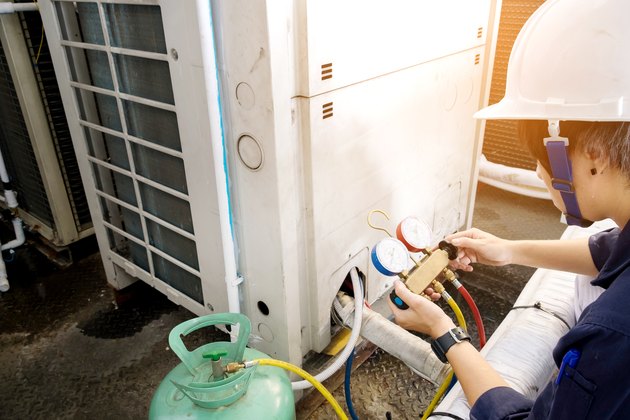 Technician is checking air conditioner
