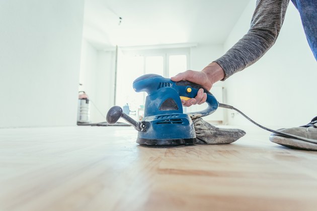 Renovating at home: sander tool for refreshing and grinding the wooden parquet floor