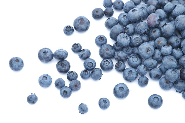 Blueberries scattered on white background