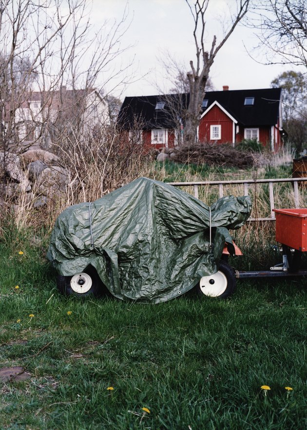 Tractor with plastic rain cover