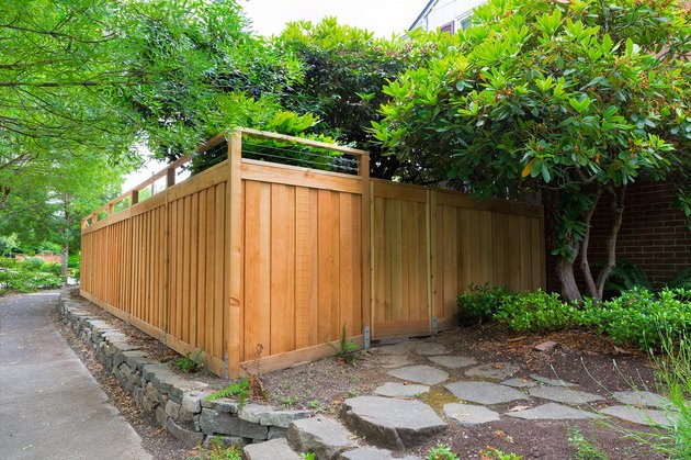 New Cedar Wood Fence around house side yard landscaping