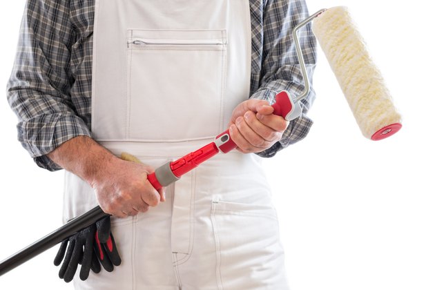 Painter in white overalls.