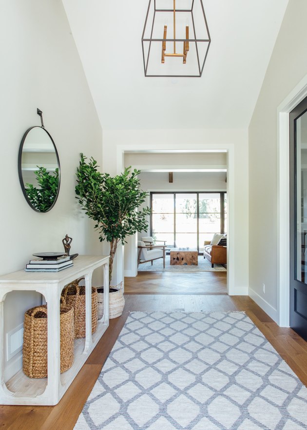 Baskets and console table as hallway storage, designed by Michelle Lisac Interior Design