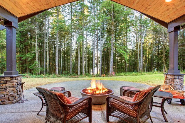 Large back yard with grass.