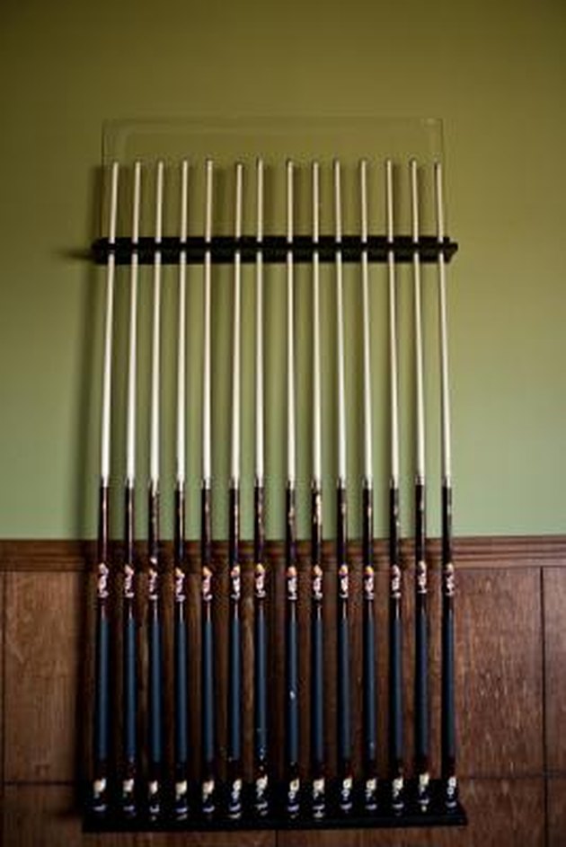 pool cue racks are neater than leaning cues against walls.