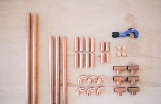 all the copper pieces needed for the clothing rack, including t-joints, elbow fittings, and end caps