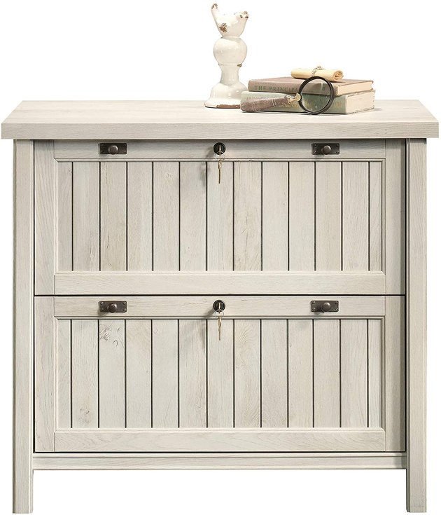 No one will ever know you're storing your files away safely with this beautiful filing cabinet. This 2 drawer lateral filing cabinet will easily blend in with the rest of your home decor.