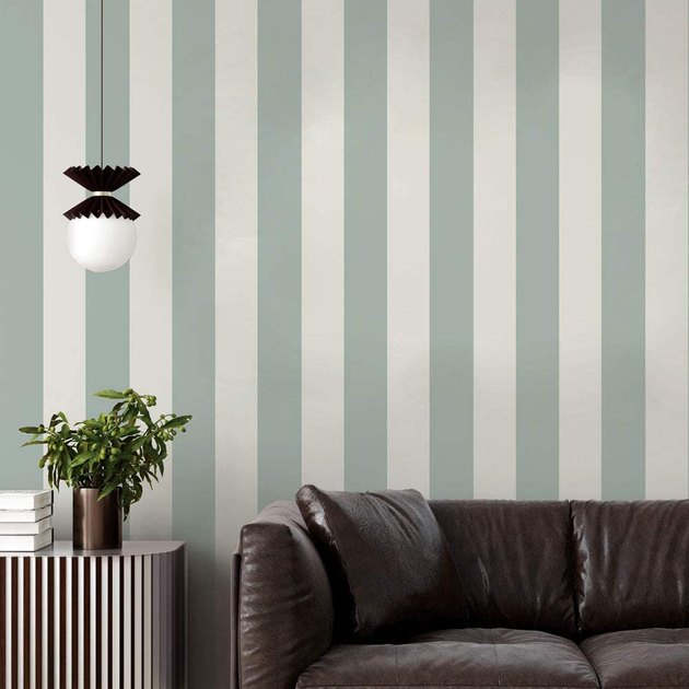 Striped wallpaper will never go out of style, so make a timeless choice with this soft green and cream pattern.