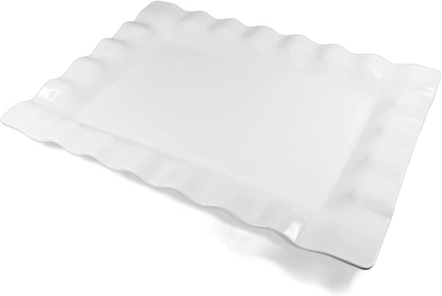 This classic white serving platter that is perfect for skewers right off the grill or even a Thanksgiving turkey. It's made of durable melamine, so it's shatterproof and dishwasher safe.