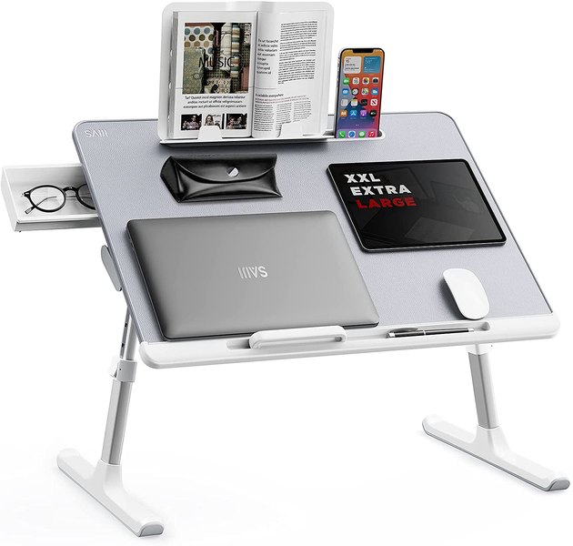 If you love working from your bed, this bed tray is for you. You can adjust the height and angle of the tray with ease, and utilize all of its compartments for everything from your computer mouse to phone.