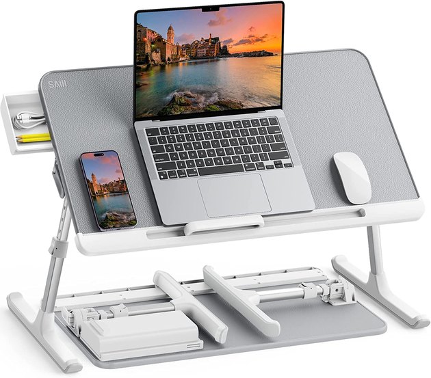 This game-changing ergonomic laptop stand is great for those working from their bed. It can be customized to your preferred height and angle and includes a small drawer to keep important items close by.