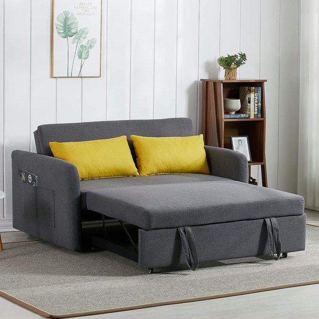 Turn your studio apartment or home office into an instant guest-friendly space with the help of this convertible loveseat. When bedtime rolls around, it pulls out into a sleeper sofa — complete with USB charging ports and storage pockets.