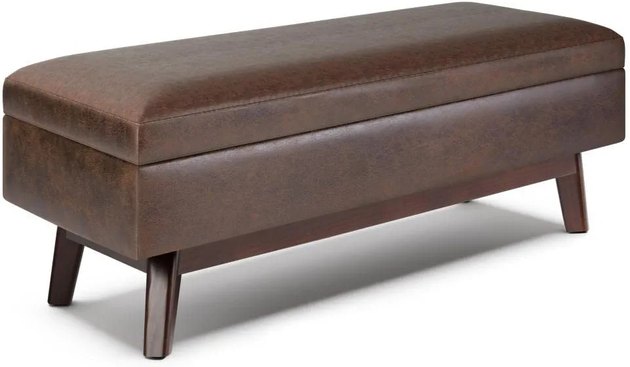 Perfect for an office or den, this leather storage bench could also work as an ottoman or a coffee table (just place a tray atop it before you use it for drinks!).