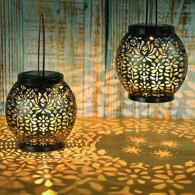 This set of two solar lanterns emits lovely star and flower patterns when illuminated. They can be placed on a table or hung from a tree to create a warm, cozy setting. 