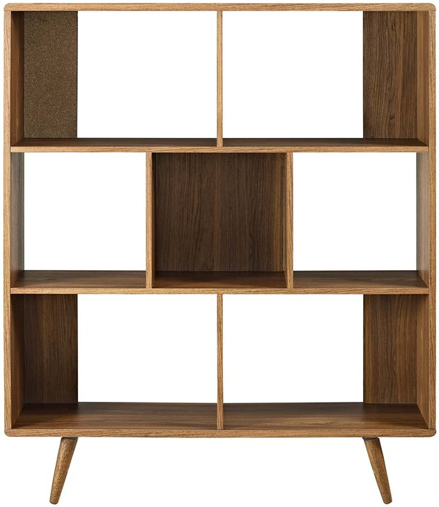 Organizing your books and putting your favorite accent pieces on display has never been easier than with this spacious bookshelf. It has seven large shelves and a walnut wood grain finish for that functional midcentury modern style we know and love.